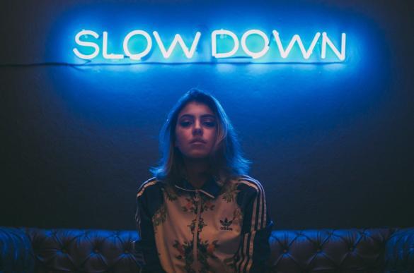 Slow down in blue letters to reduce stress and choose for yourself free time